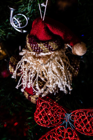 Christmas hanging decorations on fir tree. Decorated Christmas tree. Fir branch with Christmas baubles decorations.の写真素材