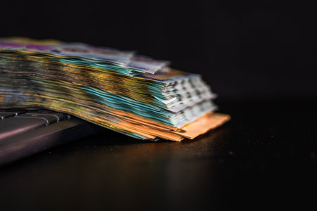 Lei banknotes on keyboard. Selective focus on stack of LEI romanian money.の写真素材