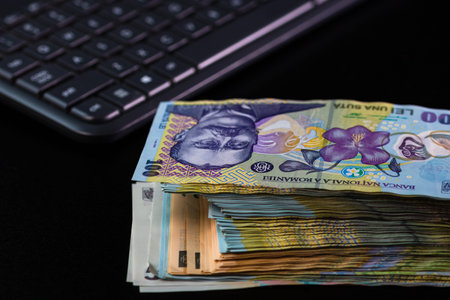 Selective focus on stack of LEI romanian money. Lei banknotes isolated.