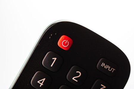 Selective focus, details of TV remote control buttons. Bucharest, Romania, 2021.