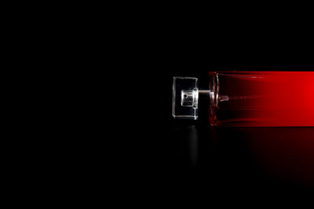 Elegant perfume bottle isolated on black background with copy space.の写真素材