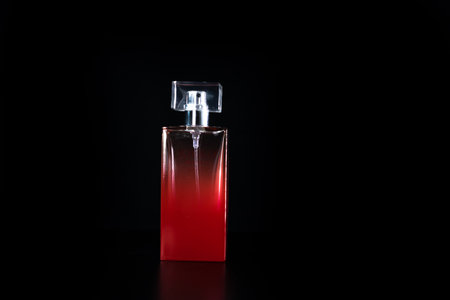 Elegant perfume bottle isolated on black background with copy space.の写真素材
