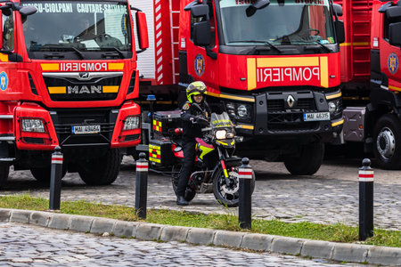 Romanian Firefighting emergency firemen (Pompierii) on motorbike parked in front of the Home Office (Ministry of the Interior) in Bucharest, Romania, 2020. SMURD emergency service on motorbikeのeditorial素材
