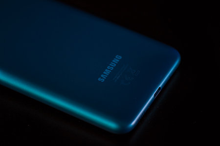 Selective focus on back of new smartphone Samsung Galaxy M11 . Bucharest, Romania, 2021のeditorial素材