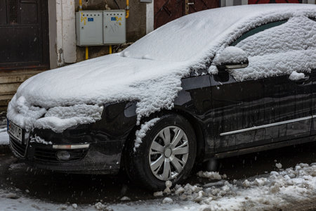 Snow on cars in the morning. Winter season, icy cars. Winter concept, frozen cars on the road in Bucharest, Romania, 2021のeditorial素材
