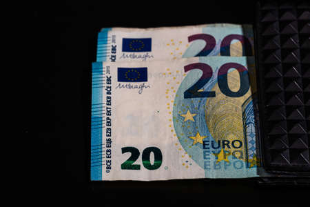 20 Euro money banknotes in black wallet isolatedの写真素材