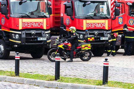 Romanian Firefighting emergency firemen (Pompierii) on motorbike parked in front of the Home Office (Ministry of the Interior) in Bucharest, Romania, 2020. SMURD emergency service on motorbikeのeditorial素材