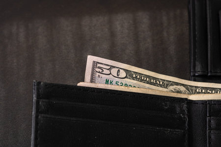 Man wallet with money on the table, wallet with dollars
