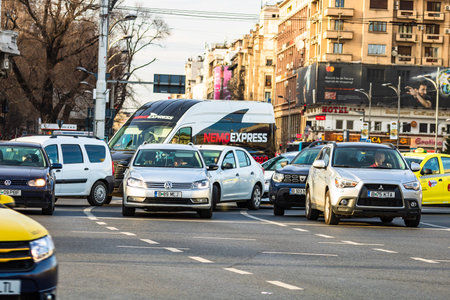 Car traffic at rush hour in downtown area of the city. Car pollution, traffic jam in the morning and...