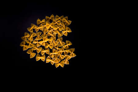 Heart made of farfalle pasta, dry pasta in a heart shapeの写真素材