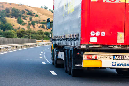 Loaded European truck in motion on asphalt road, transportation and delivery concept. Bucharest, Romania, 2020のeditorial素材