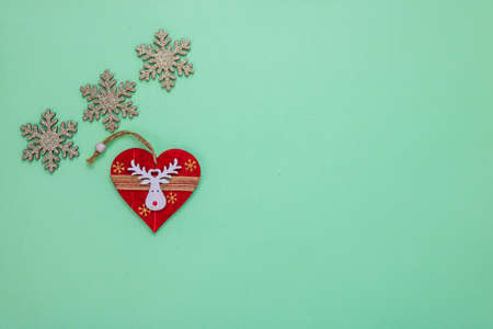 December season composition, top view with copy space on green background. Christmas composition with ornaments and decorations.の写真素材