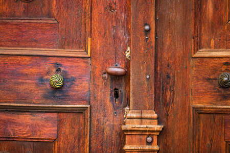 Close up, details of an old wooden brown door.の写真素材