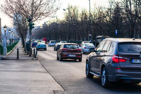 Car traffic at rush hour in downtown area of the city. Car pollution, traffic jam in the morning and evening in the capital city of Bucharest, Romania, 2020のeditorial素材