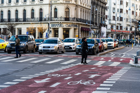 Car traffic at rush hour in downtown area of the city. Car pollution, traffic jam in the morning and...