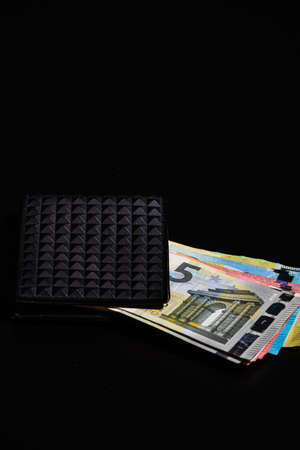 Euro banknotes in black wallet isolated.の写真素材