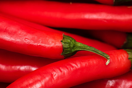 Red hot chili peppers, close up. Background of red chilies
