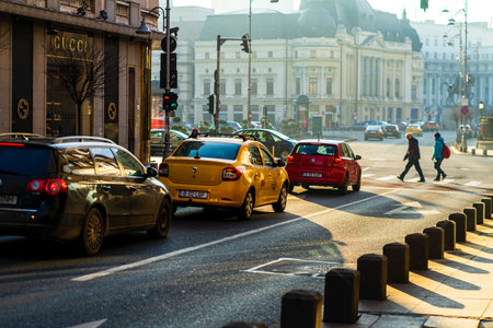 Car traffic at rush hour in downtown area of the city. Car pollution, traffic jam in the morning and...