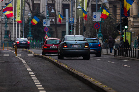 Car traffic at rush hour in downtown area of the city. Car pollution, traffic jam in the morning and...