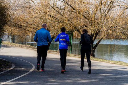 Jogging, running in the city park. Healthy lifestyle, outdoor physical activity and fitness concept in Bucharest, Romania, 2021のeditorial素材