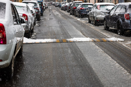 Snowing on cars in the morning, snow on street in Bucharest, Romania, 2021