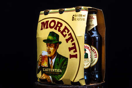 6 pack of Birra Moretti beer on wooden barrel with dark background. Illustrative editorial photo Bucharest, Romania, 2021のeditorial素材