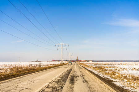 Winter season, view of cars and snowy street through windshield while driving in Bucharest, Romania, 2021.の写真素材