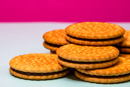 Round biscuits with chocolate cream, sandwich biscuits with chocolate filling isolated.の写真素材