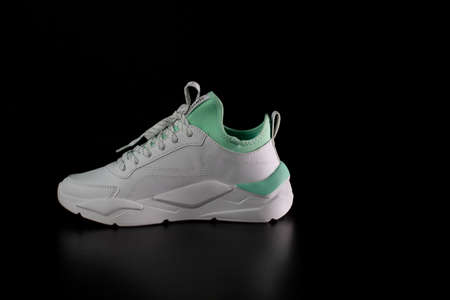 Close up of sport shoes isolated on black background. Bucharest, Romania, 2021のeditorial素材