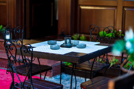 Close up of an empty tables with empty chairs at a local outdoor resturant in Bucharest, Romania, 2021のeditorial素材