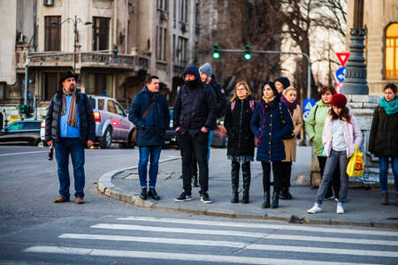 People moving, walking on the streets in downtown of Bucharest, Romania, 2021のeditorial素材
