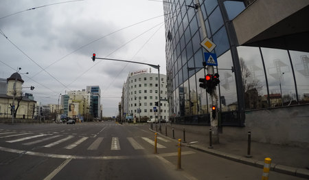 Changes and complications caused by coronavirus epidemy, world without crowds, virus empties streets. No traffic jam, no pollution, empty streets in downtown Bucharest, Romania, 2020のeditorial素材