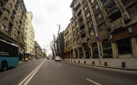 Changes and complications caused by coronavirus epidemy, world without crowds, virus empties streets. No traffic jam, no pollution, empty streets in downtown Bucharest, Romania, 2020のeditorial素材