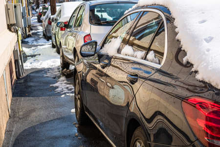 Snow on cars in the morning, snow on street in Bucharest, Romania, 2021のeditorial素材