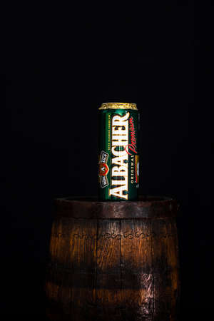 Can of Albacher beer on beer barrel with dark background. Illustrative editorial photo shot in Bucharest, Romania, 2021のeditorial素材