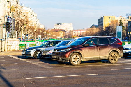 Car traffic at rush hour in downtown area of the city. Car pollution, traffic jam in the morning and...
