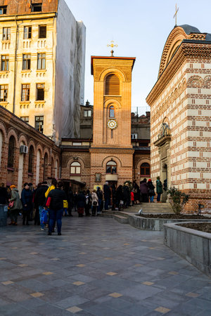 Crowd of people waiting in front of an orthodox church in Bucharest, Romania, 2021