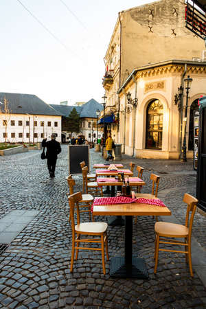 Close up of an empty tables with empty chairs at a local outdoor resturant in Bucharest, Romania, 2021のeditorial素材