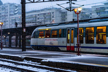 Winter detail train view. Train on the platform of Bucharest North Railway Station (Gara de Nord Bucuresti) in Bucharest, Romania, 2021のeditorial素材