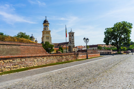 Orthodox and catholic cathedral view on sunny day in Alba Iulia, Romania, 2021のeditorial素材