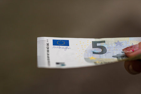 Selective focus on detail of EURO banknotes. Counting or giving EURO banknotes. World money concept,...