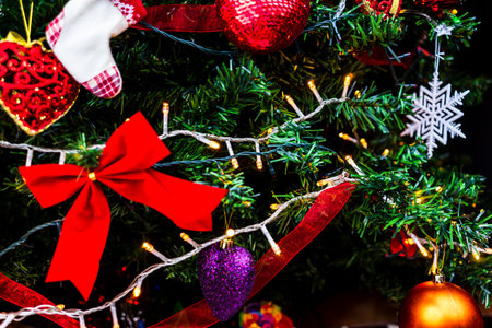 Christmas hanging decorations on fir tree. Decorated Christmas tree. Fir branch with Christmas...