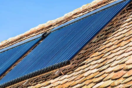 Close up of solar water heater on roof top. Solar panel for hot water, system on roof.の写真素材