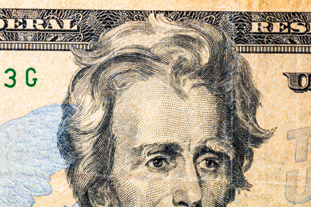 Selective focus on detail of USD banknotes. Close up macro detail of United States Dollars...