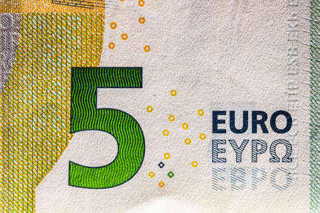 Selective focus on detail of EURO banknotes. Close up macro detail of EURO banknotes. World money concept, inflation and economy conceptの写真素材