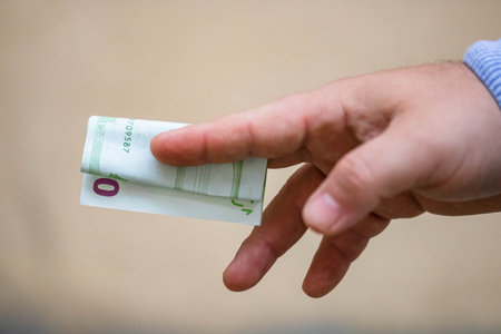 Selective focus on detail of EURO banknotes. Counting or giving EURO banknotes. World money concept,...