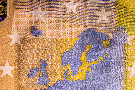 Selective focus on detail of EURO banknotes. Close up macro detail of EURO banknotes. World money concept, inflation and economy conceptの写真素材