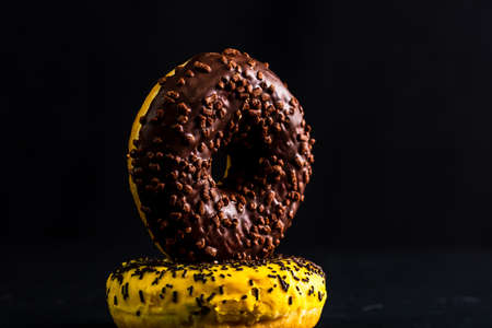 Glazed donuts with sprinkles isolated. Close up of colorful donuts.の写真素材