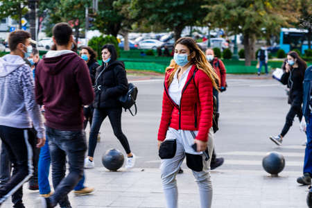 People moving, pedestrians walking in downtown district of Bucharest, Romania, 2021のeditorial素材