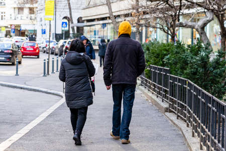 People moving, pedestrians walking in downtown district of Bucharest, Romania, 2021のeditorial素材